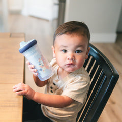 The First Years Bluey sippy cup with valve helps minimize spills during travel.