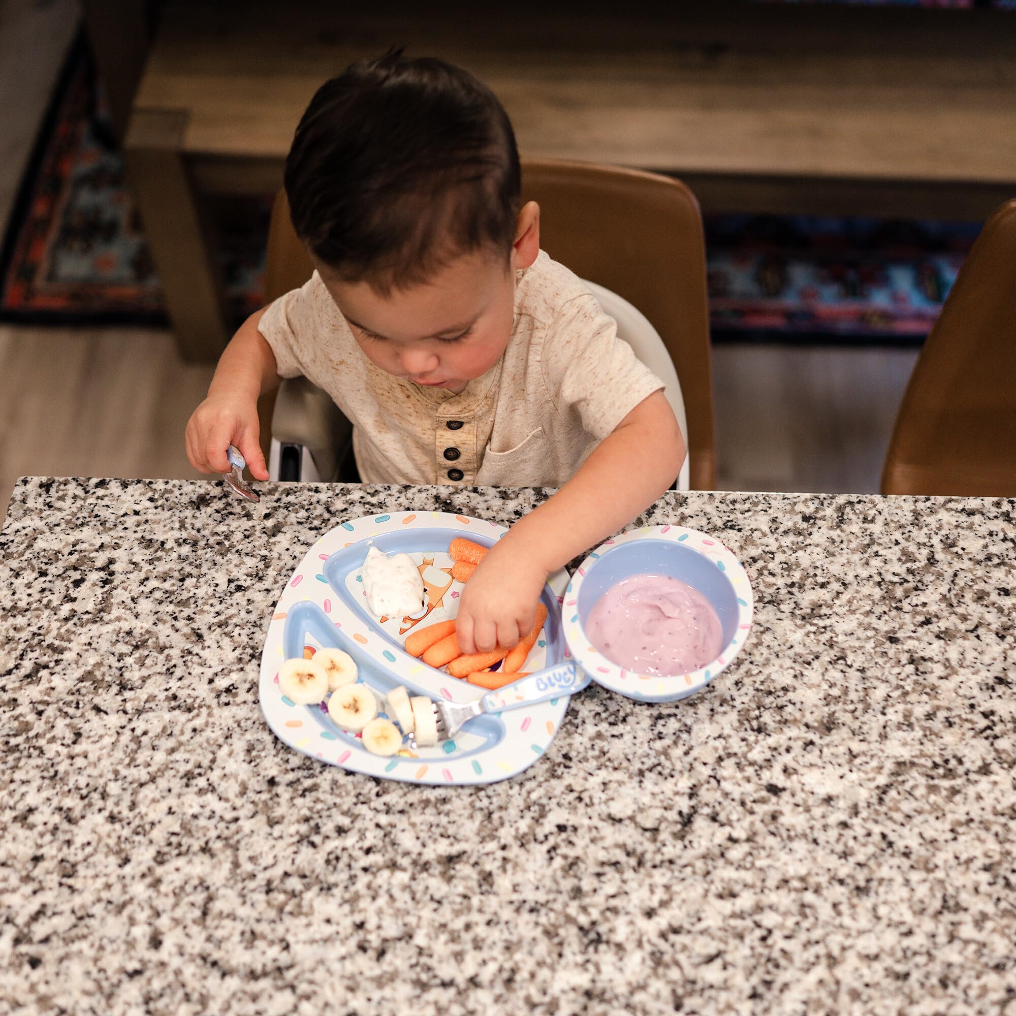 The First Years Bluey toddler fork designed for tiny fingers with easy grip.