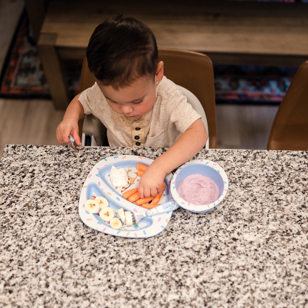 The First Years Bluey toddler fork designed for tiny fingers with easy grip.