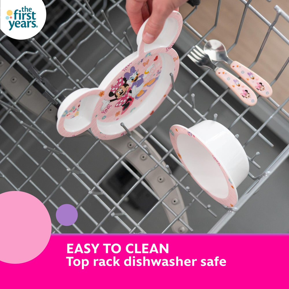 The First Years Minnie Mouse spoon with toddler-friendly handle supports independent eating.