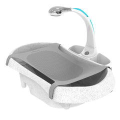 The First Years Rain Shower newborn sling provides gentle support during bath time.