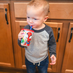 The First Years Spidey Take & Toss 10oz cup with translucent sides shows remaining beverage.