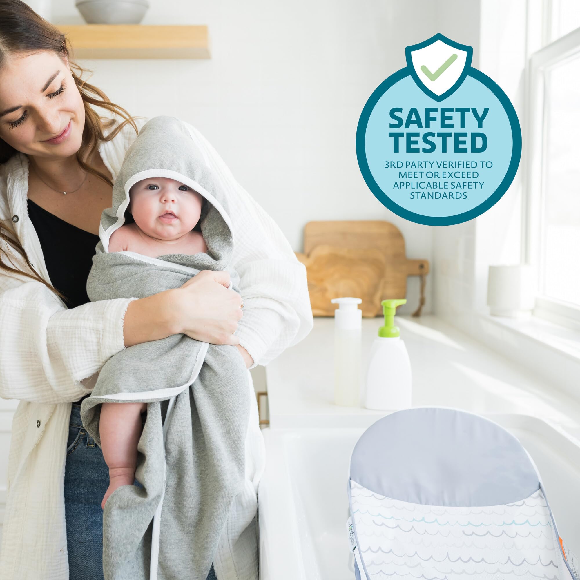 The First Years Sure Comfort folding bather supports infants up to 15 lbs.