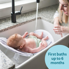 The First Years Sure Comfort folding bather with non-slip seat keeps bath secure.