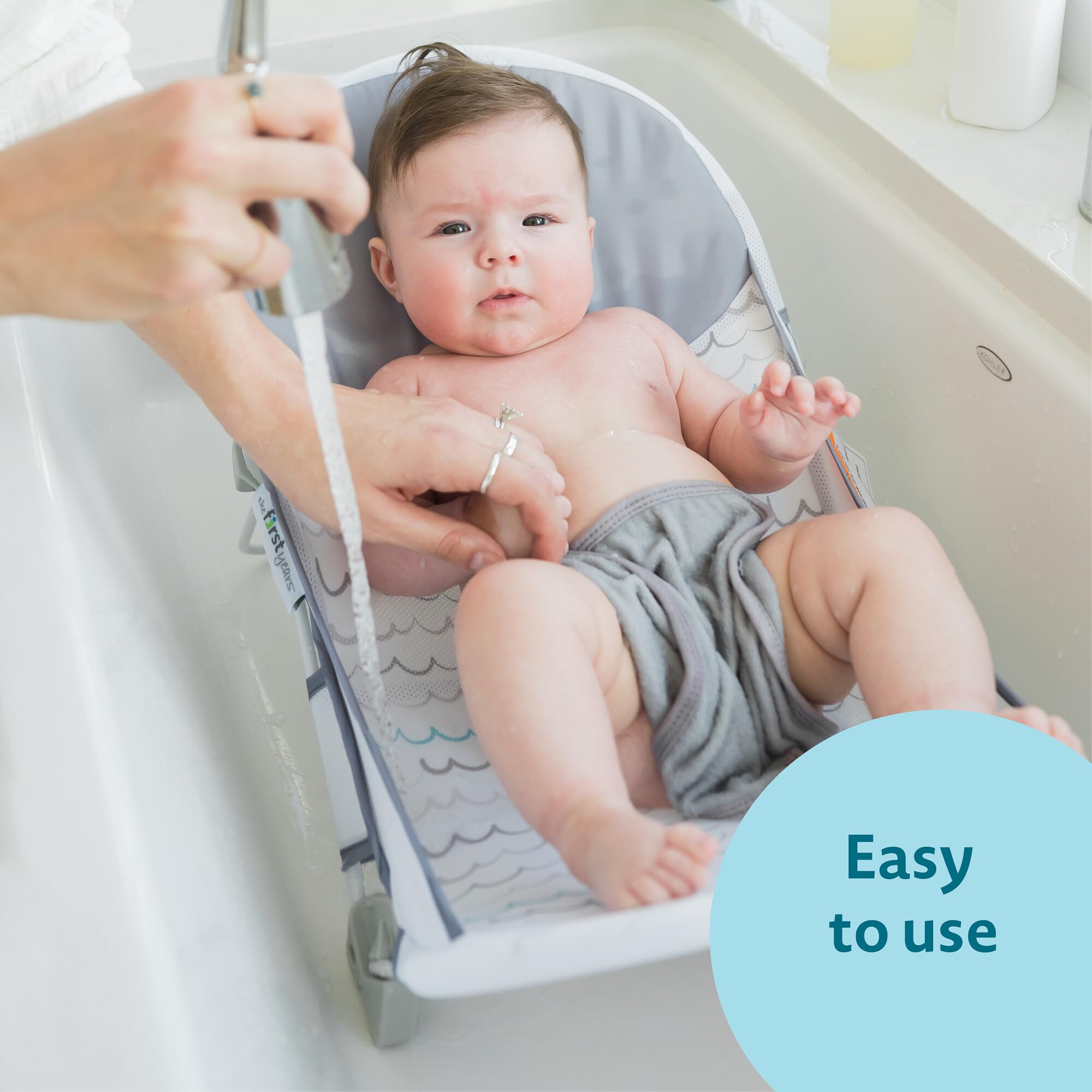 The First Years Sure Comfort folding bather features raised mesh sides for comfort.