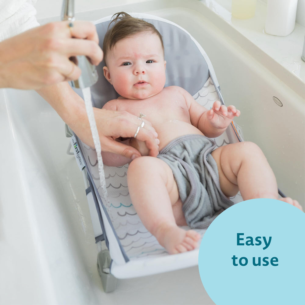 The First Years Sure Comfort folding bather features raised mesh sides for comfort.