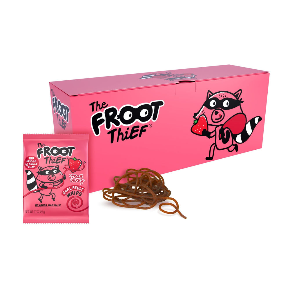 The FROOT Thief strawberry snack whip in a lunchbox, a convenient fruit treat for kids.