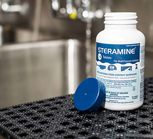Steramine tablets sanitizing utensils in a busy restaurant environment