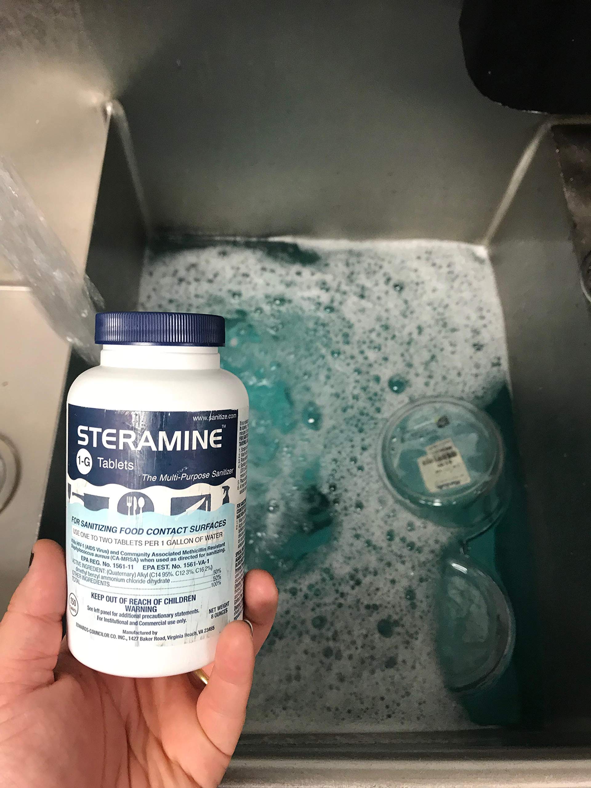 Close-up of Steramine bottle cap and blue sanitizing solution.