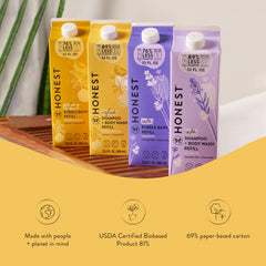 The Honest Company bottle close-up highlighting naturally derived botanicals and essential oils.