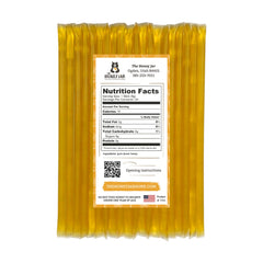 The Honey Jar honey sticks close-up shows pure clover honey and BPA-free packaging.