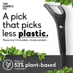 Charcoal Humble Co floss pick aiding interdental cleaning between teeth