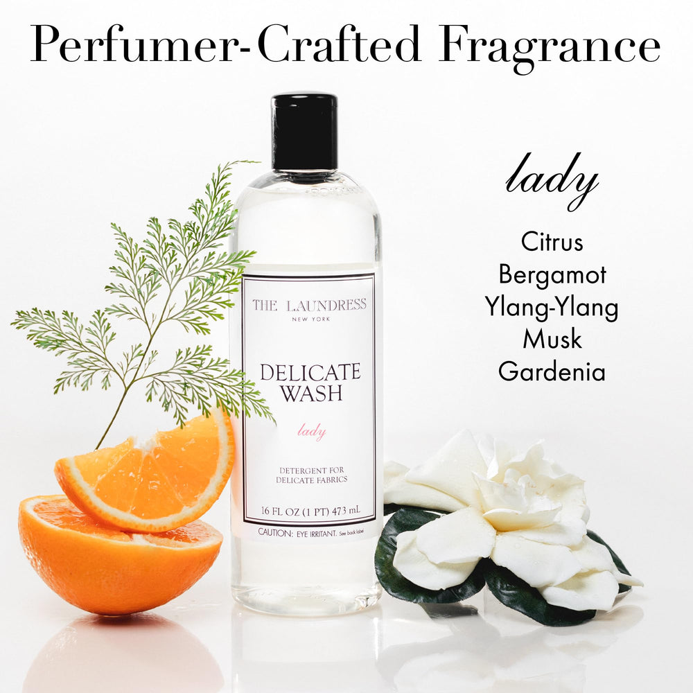 The Laundress Delicate Wash measuring cup demo shows precise dosing for 31 loads.