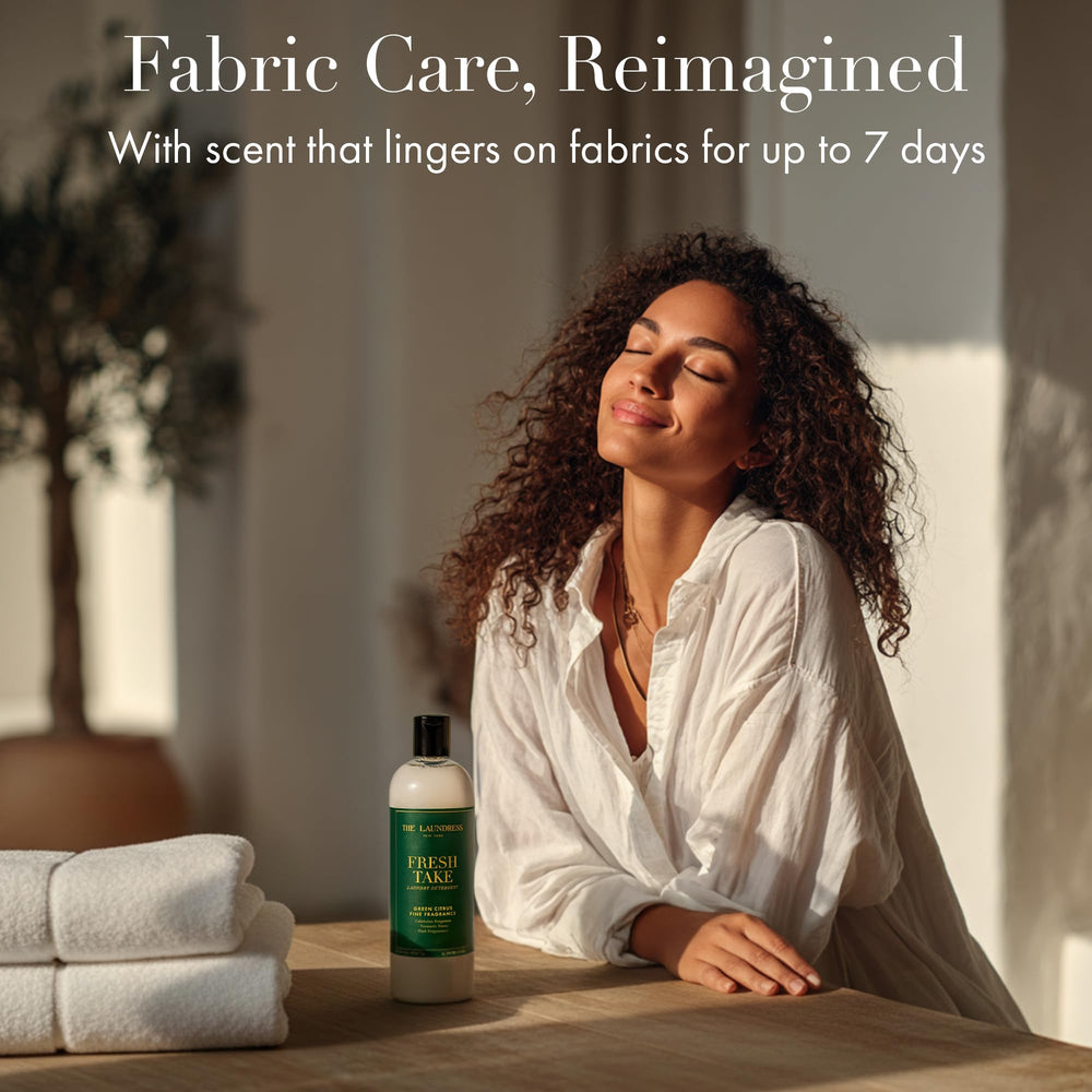 The Laundress Fresh Take bottle label communicates BioRadiance technology and 15-load performance.