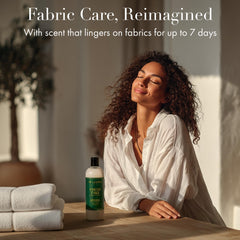 The Laundress Fresh Take bottle label communicates BioRadiance technology and 15-load performance.