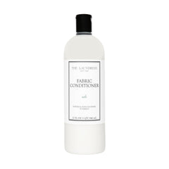 The Laundress Isle Fabric Conditioner bottle softens fabrics with Isle scent