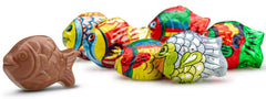 Stack of Madelaine milk chocolate mini fish, compact 1.5 inch size