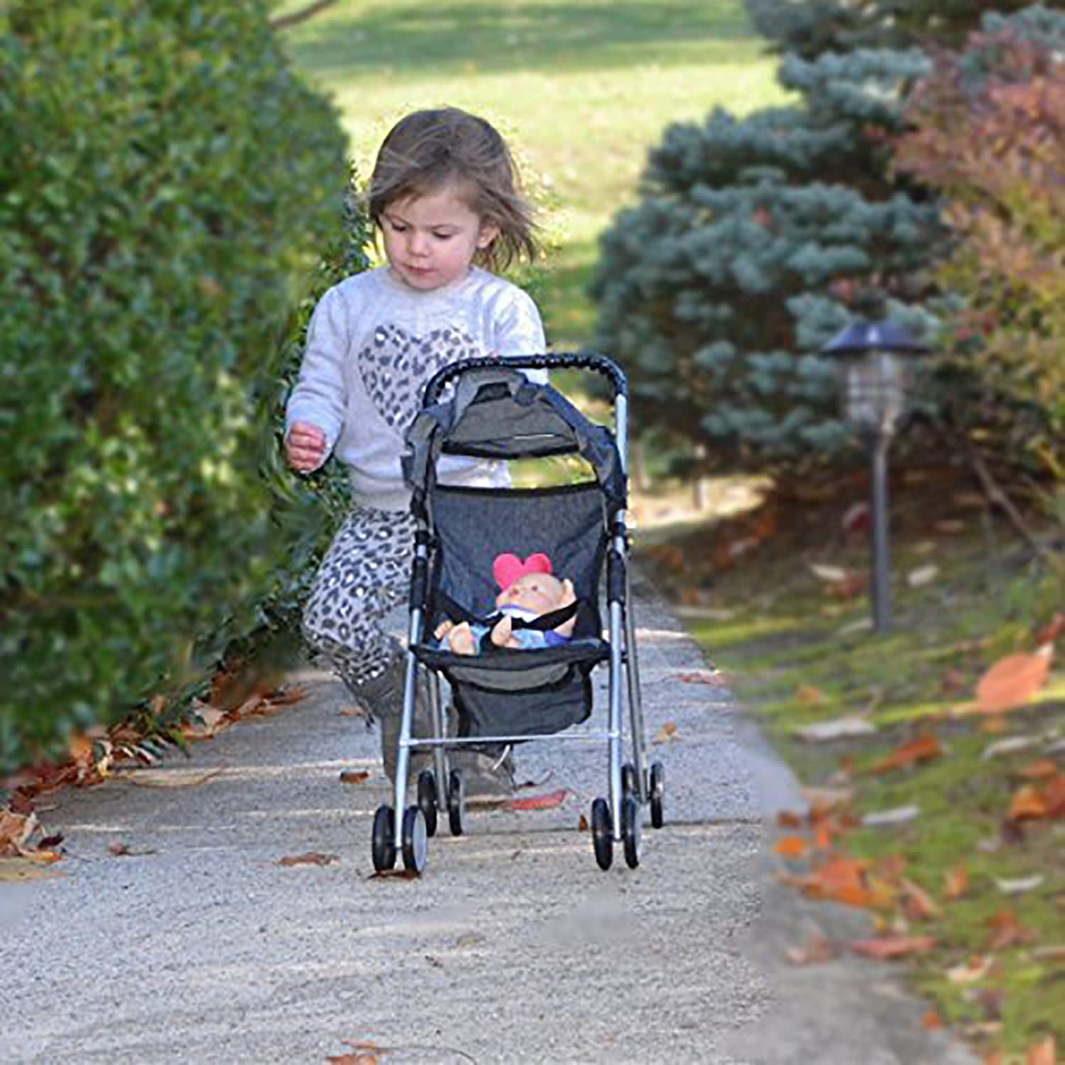 The New York Doll Collection My First Doll Stroller Denim Basket offers handy storage for accessories.