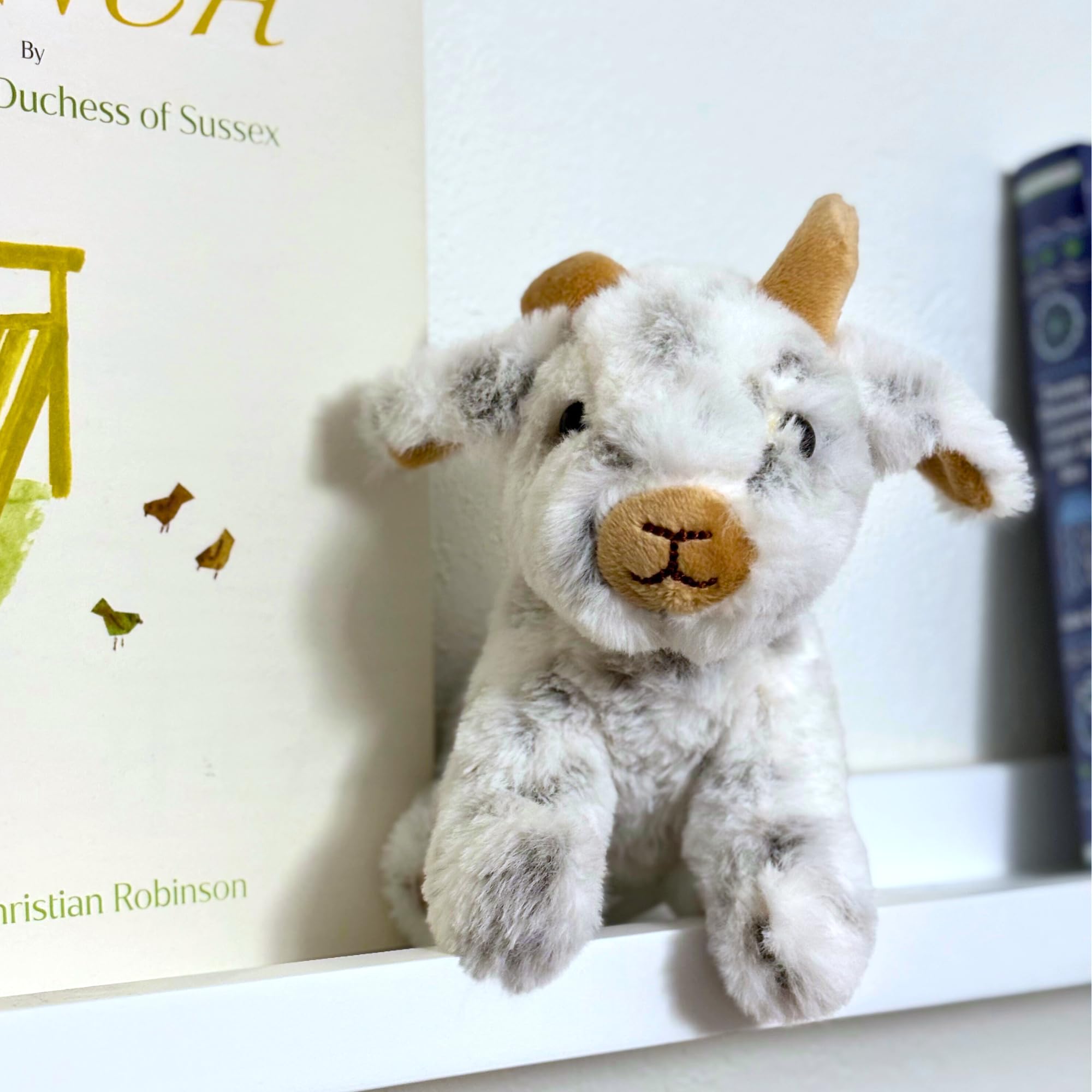The Petting Zoo goat plush has a soft cuddle-friendly texture.