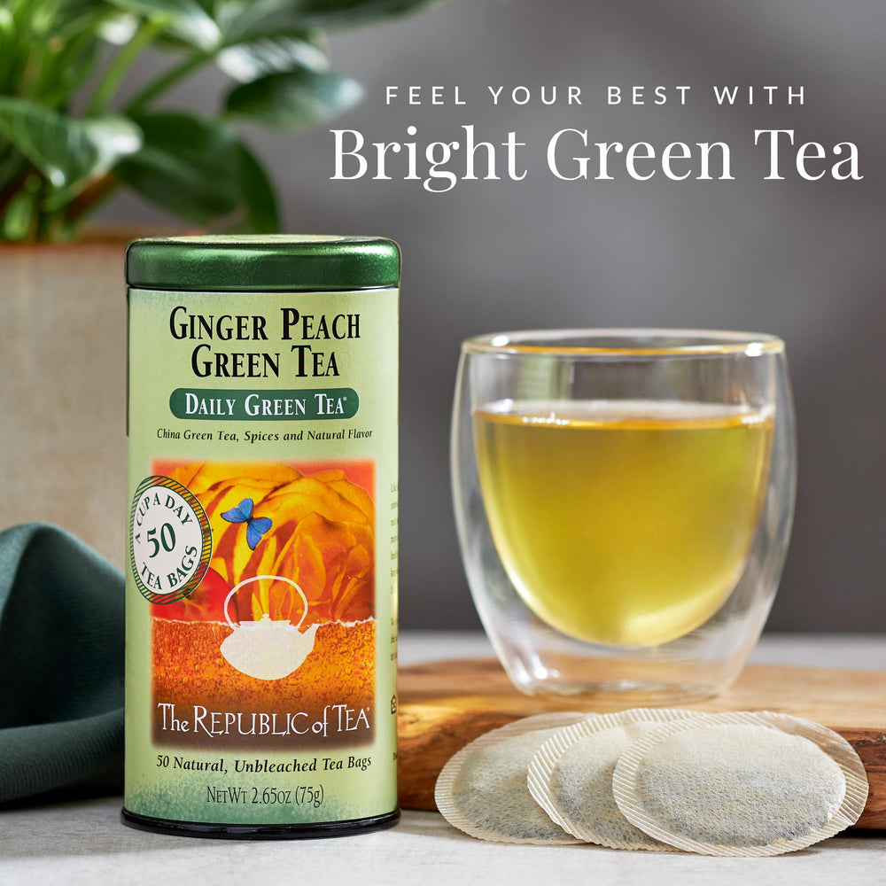 The Republic of Tea Ginger Peach Green Tea label close-up highlighting natural flavors and aroma.