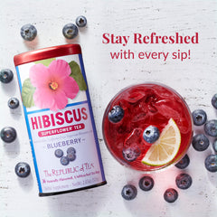 The Republic of Tea Hibiscus Blueberry Superflower being poured for a fragrant, caffeine-free cup.