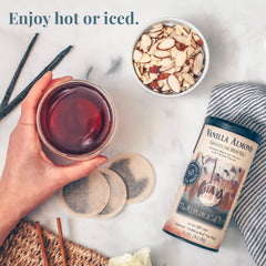 Steaming cup of Vanilla Almond tea by The Republic of Tea showcasing creamy notes.