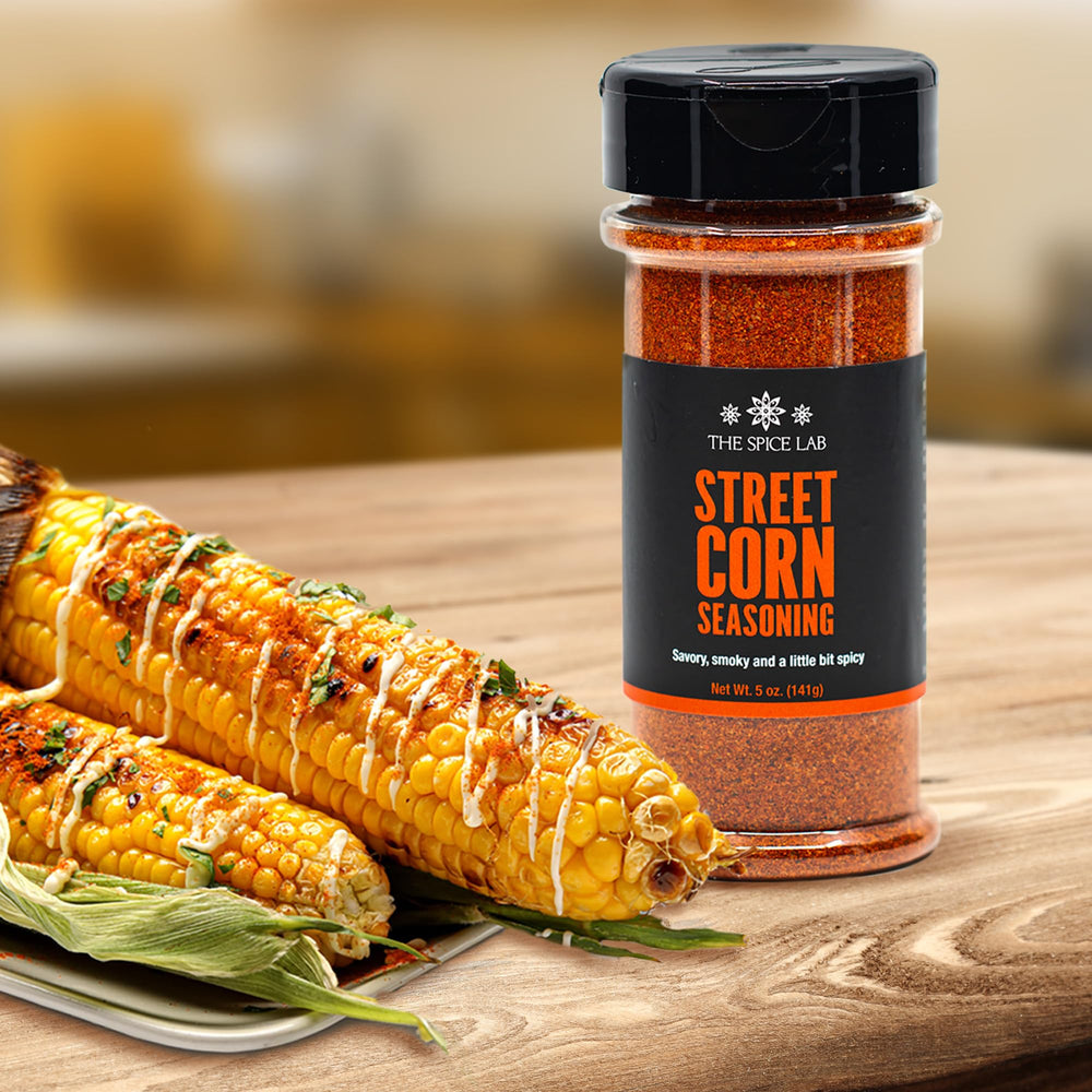 Grilled corn dusted with The Spice Lab elote seasoning for authentic flavor