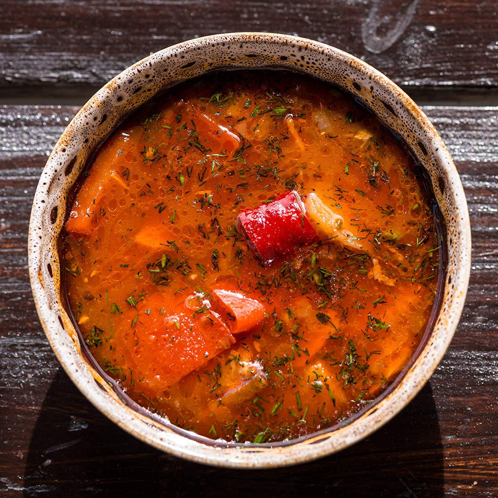 The Spice Lab Sweet Paprika Powder on textured surface suggests versatile kitchen use.