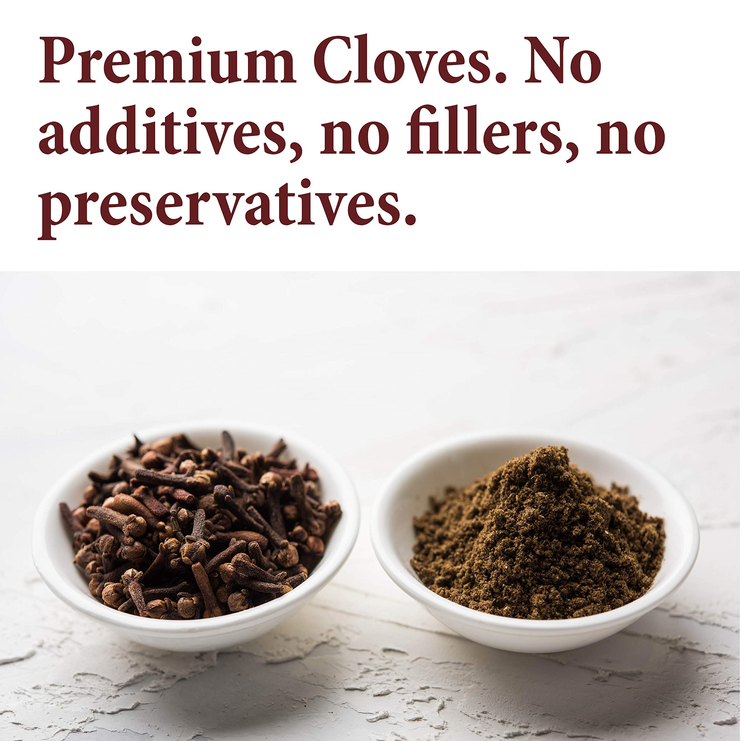 The Spice Way whole cloves held in hand for versatile seasoning.