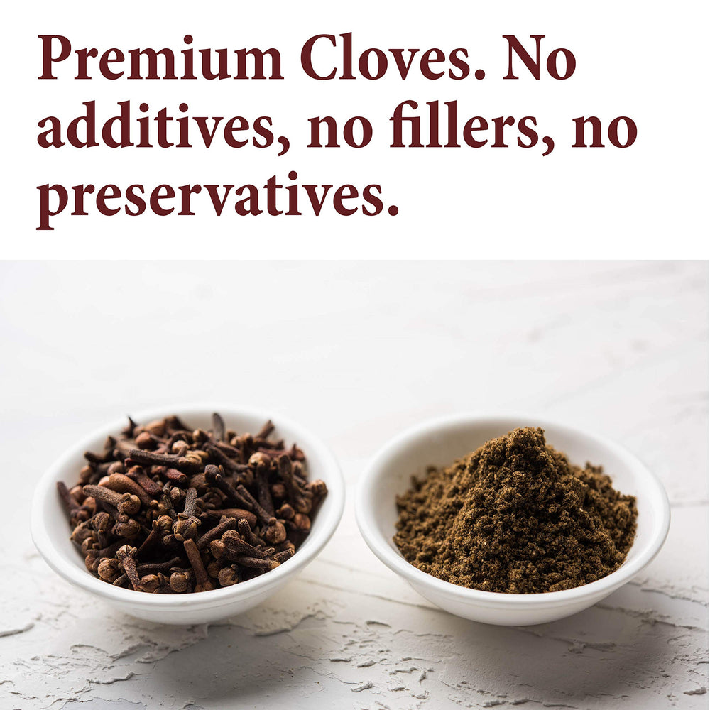 The Spice Way whole cloves held in hand for versatile seasoning.