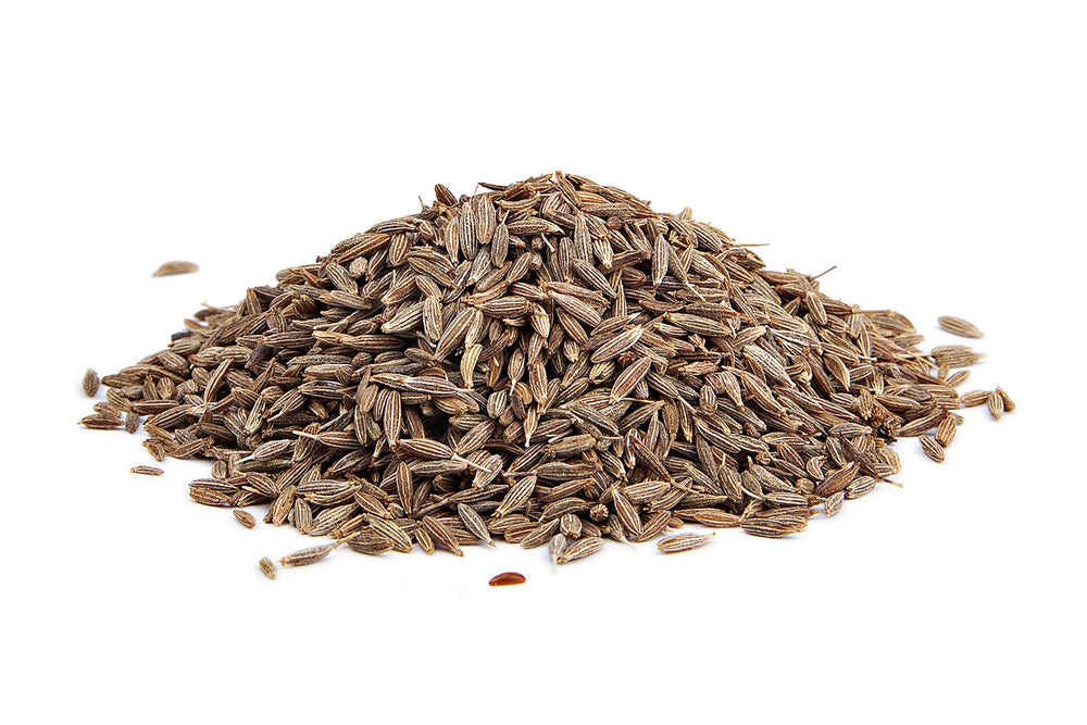 The Spice Way cumin seeds over a dish of rice with earthy aroma.