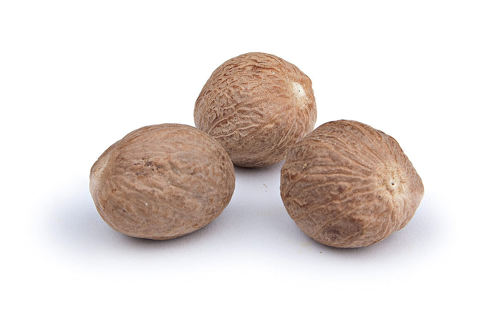 The Spice Way Nutmeg Whole on a spoon for precise seasoning.
