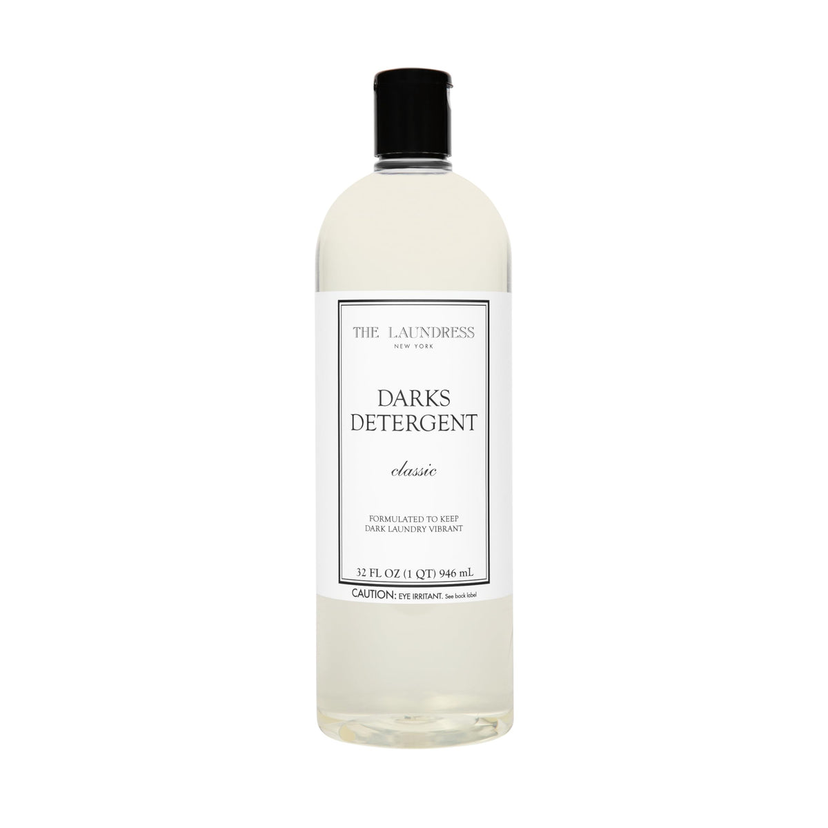The Laundress Darks Detergent bottle pour showing stain-fighting care for vibrant darks