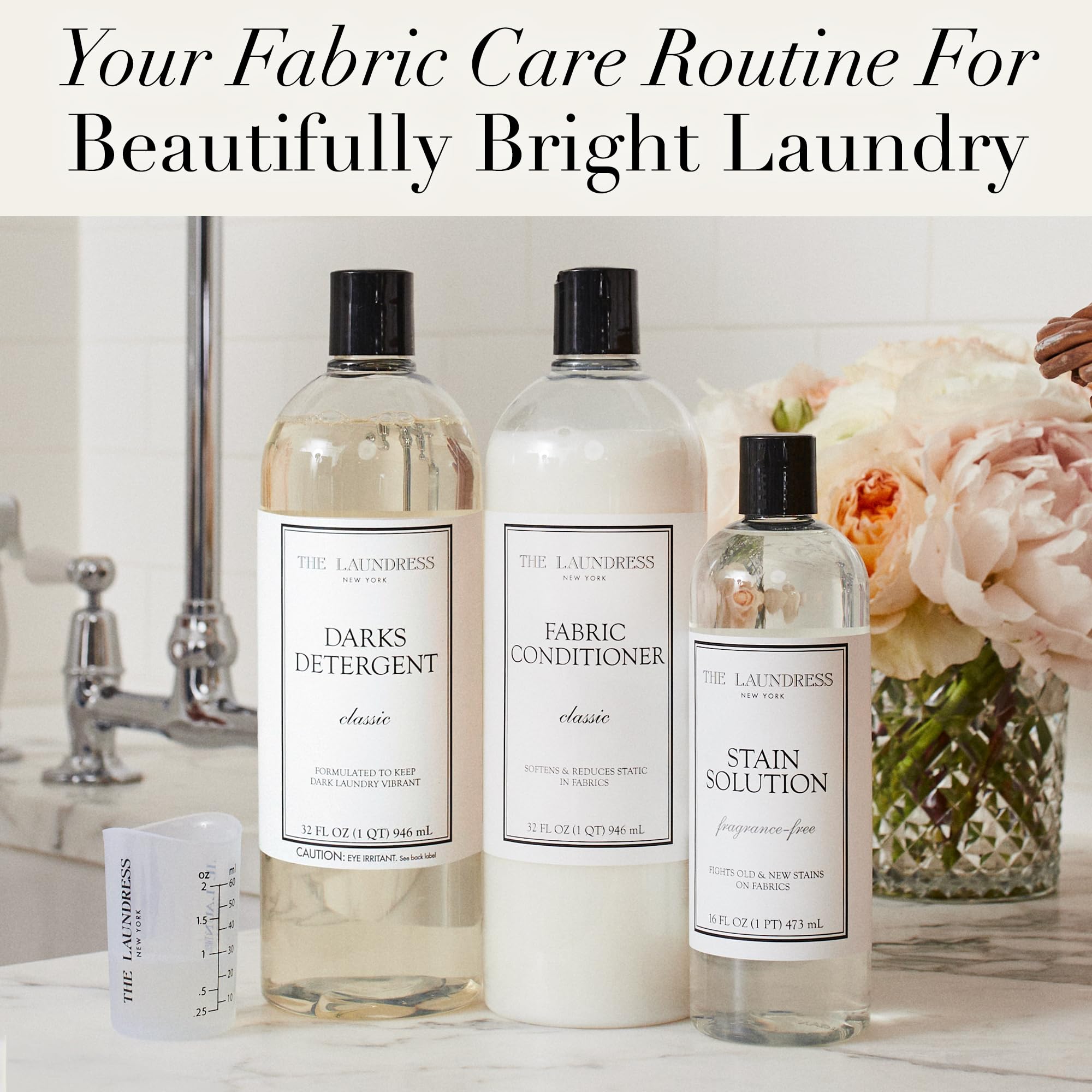 Measuring cup pairing with The Laundress Darks Detergent demonstrates easy dosing