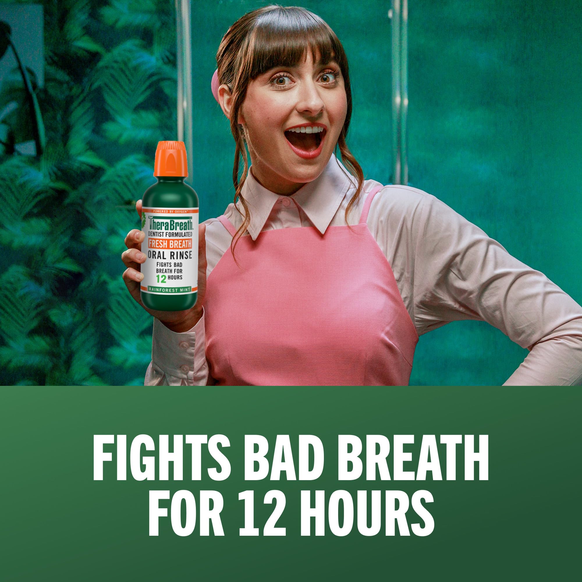 Pouring TheraBreath mouthwash to measure the 2 teaspoons dose.