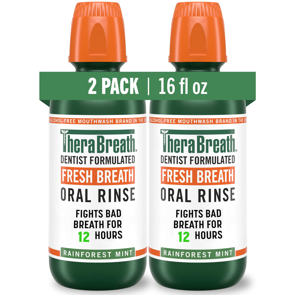 TheraBreath Rainforest Mint bottle on bathroom shelf for long-lasting freshness.