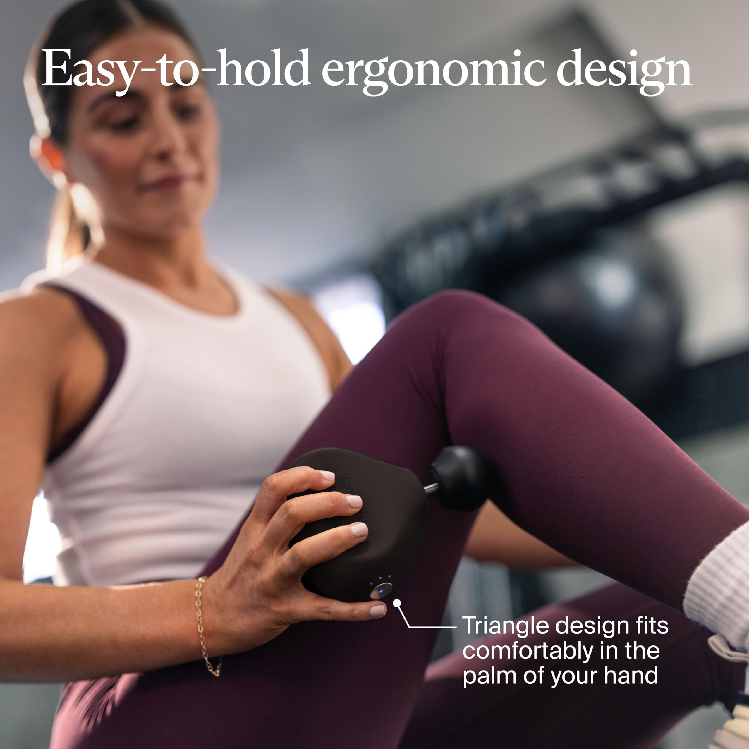 Theragun Mini thumb attachment focuses on lower back knots.