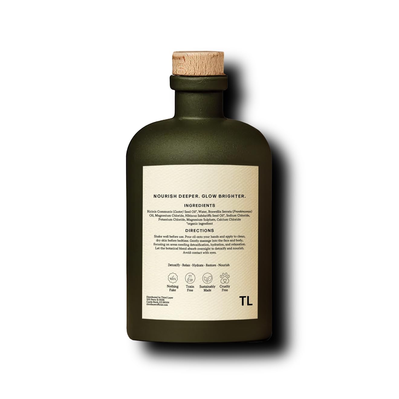 Third Layer Castor Oil Body Oil bottle on sink suggests alcohol-free skincare routine.