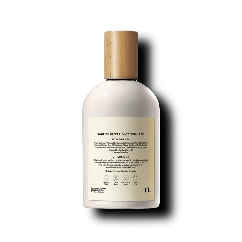 Sleek glass packaging of Third Layer Day Spray highlights a clean, alcohol-free formula.