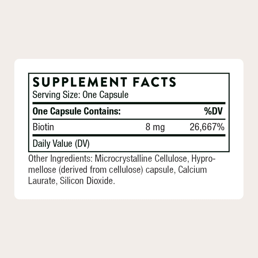 Thorne Biotin capsules close-up highlighting easy-to-swallow tablets for metabolism support.