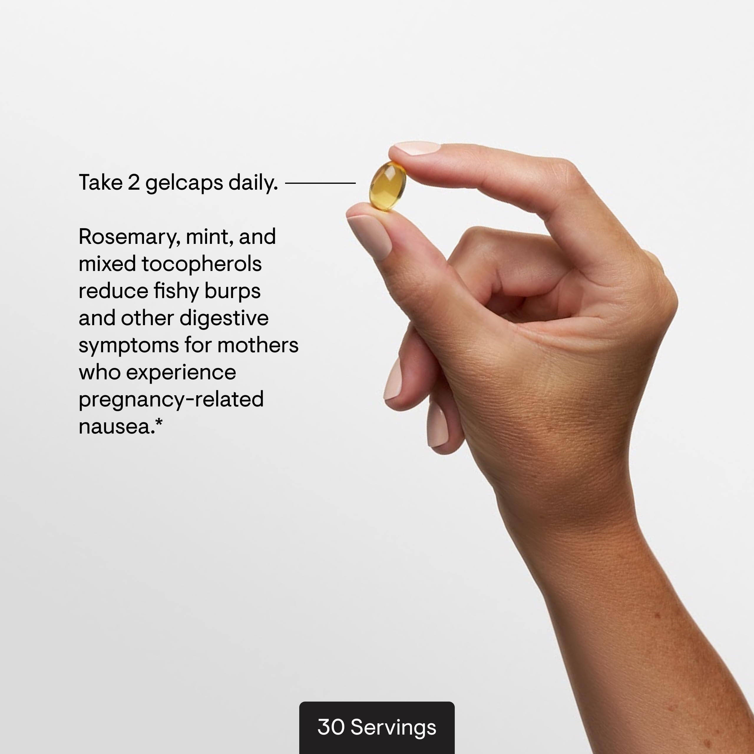THORNE gelcaps in hand, designed for gentle digestion.