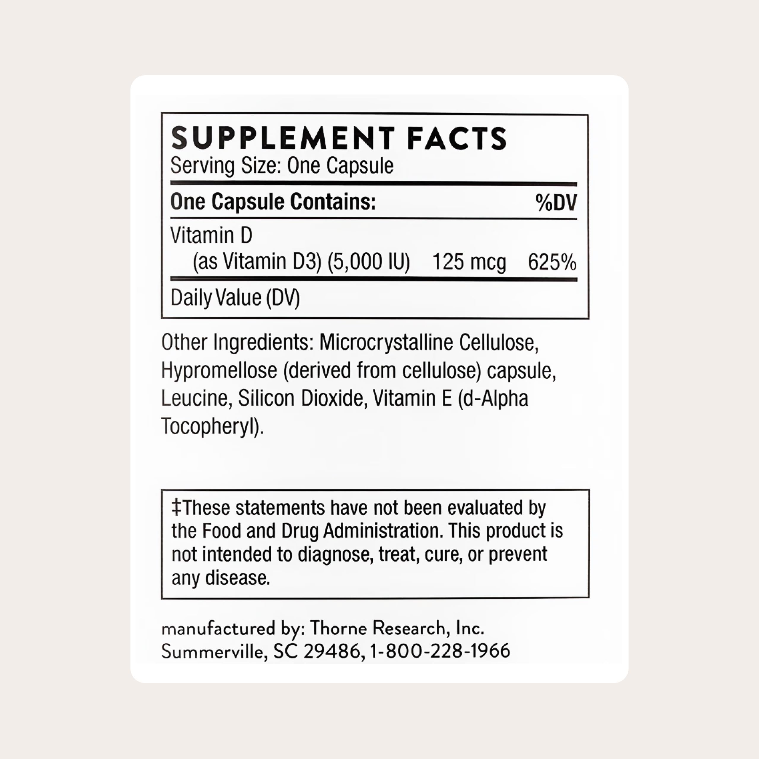 THORNE Vitamin D-5,000 capsules inside bottle; convenient for daily muscle and bone health.