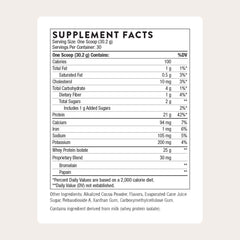 Thorne Whey Protein Isolate powder being poured highlights easy mixing and texture