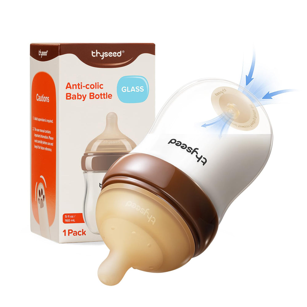 Thyseed anti-colic base-vent glass bottle shown for smoother feeding.