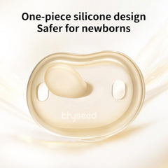 Thyseed pacifier with outward-curved shield protecting sensitive skin.