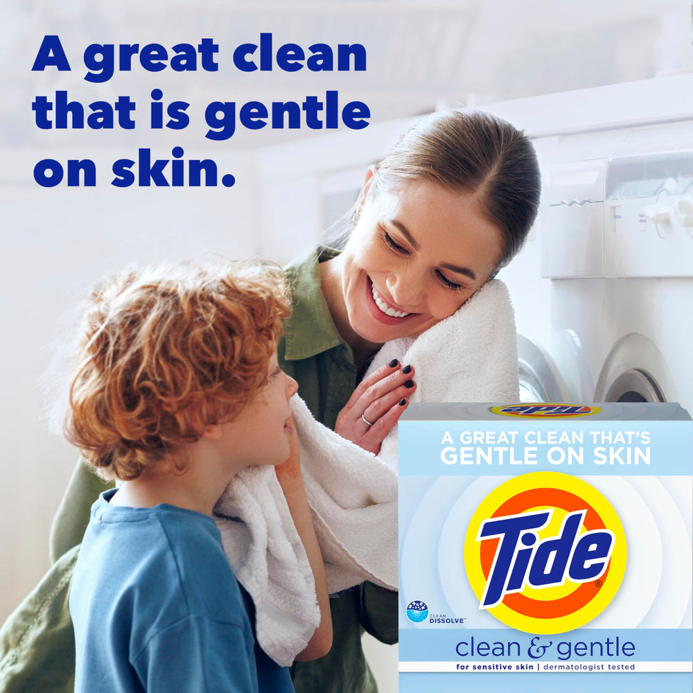 Pouring Tide Clean and Gentle powder into washing machine drum for a steady clean.