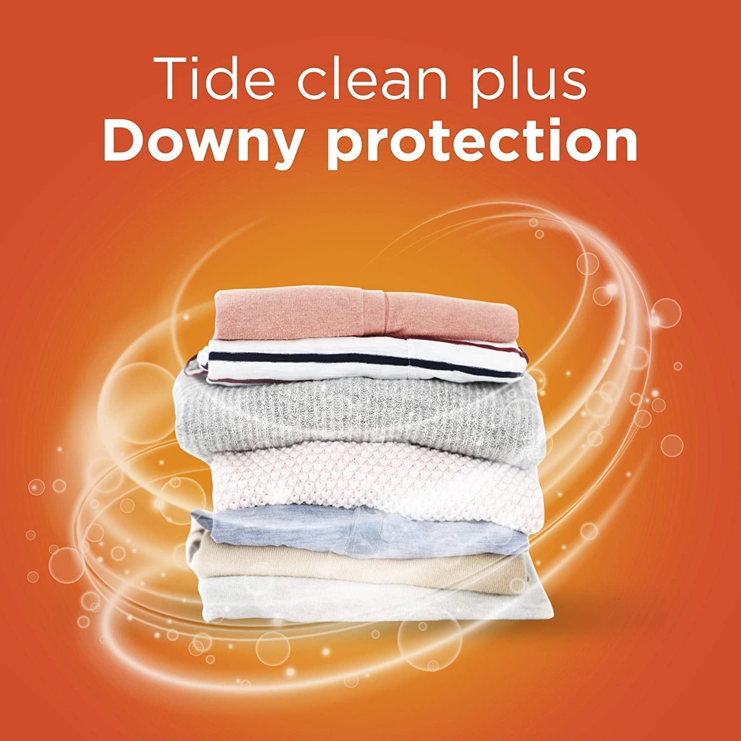 Tide PODS Downy April Fresh pods dissolving to release cleaning and conditioning.
