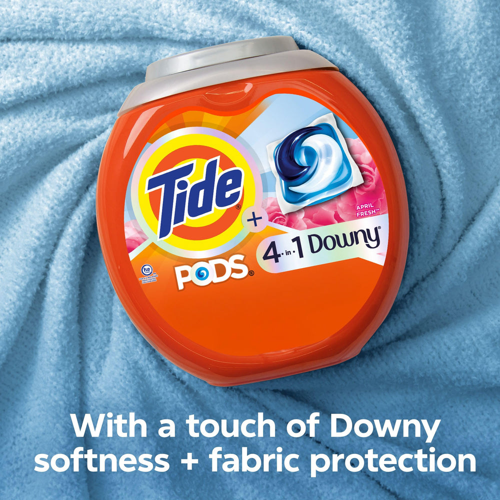 Tide PODS in a washing machine drum ready for a cycle.