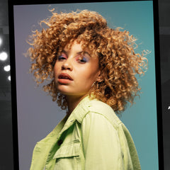 Close-up of Catwalk Curls Rock Amplifier cream for a lightweight finish.