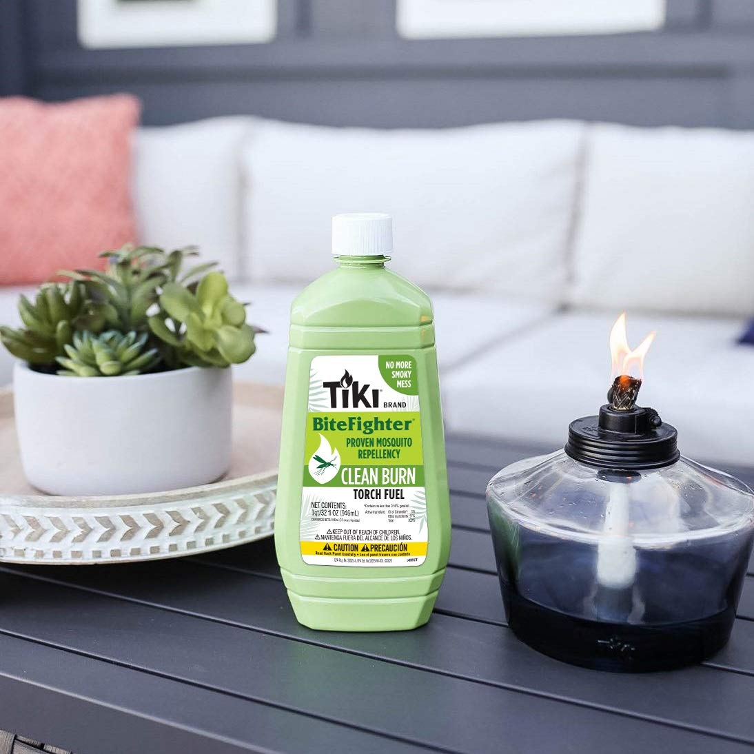 TIKI Clean Burn bottle packaged for outdoor backyard gatherings with low soot design.
